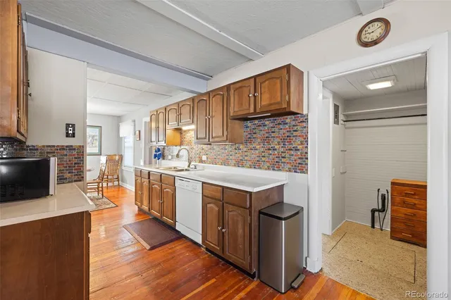 a kitchen with stainless steel appliances granite countertop a stove and a refrigerator