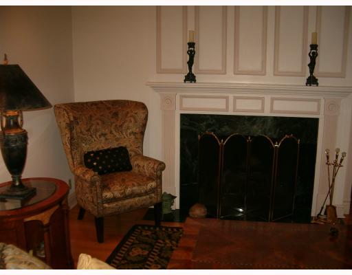 Living Room. WORKING FIREPLACE IS THE FOCAL POINT OF FORMAL LIVING AREA W/ PERFECT HARDWOOD FLOORS