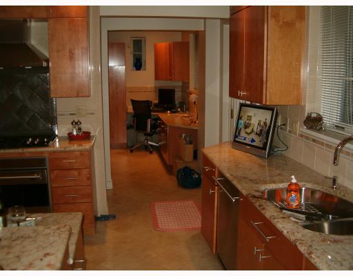Kitchen. THIS TOP OF THE LINE KITCHEN MUST BE SEEN TO BE BELIEVED! SIDE BY SIDE WOLF OVENS AND GAS COOK TOP, SUB ZERO REFRIDGE. GRANITE COUNTERS, RADIANT HEAT TILE FLOORS, ADJOINING OFFICE, LAUNDRY, BATH, AND DECK MAKE THIS KITCHEN SPECTACULAR!