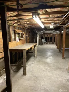 a view of room with wooden floor