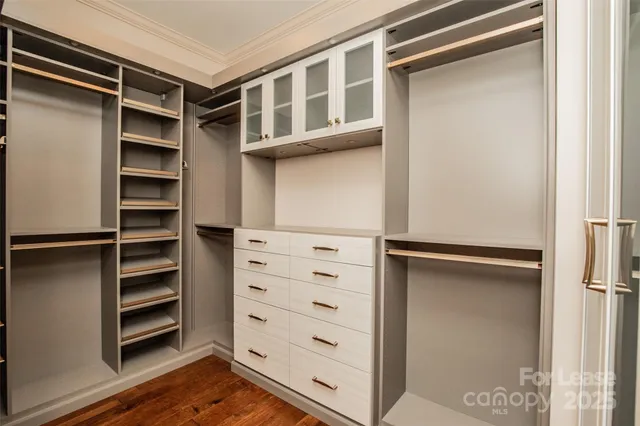 a view of an empty walk in closet