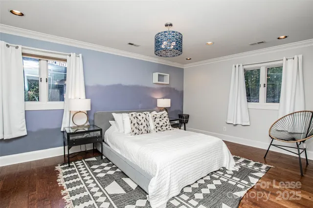 a bedroom with a bed and a chair