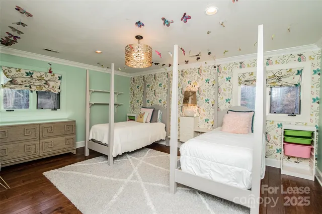 a spacious bedroom with a bed and window