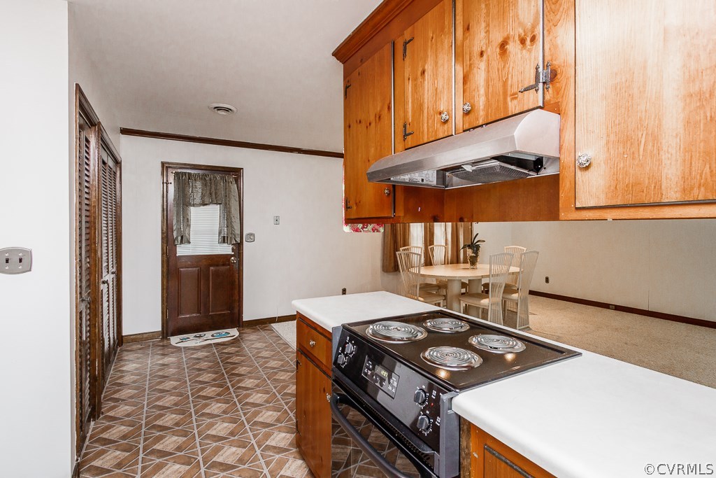 3925 Bronholly Road Chesterfield, VA 23832 - Photo 17 of 35 a kitchen with a stove and a refrigerator
