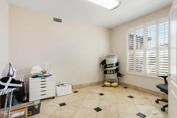 a room with a window and a view of living room