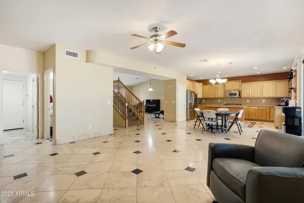 a view of a livingroom with furniture and a kitchen