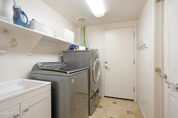 a utility room with dryer and washer