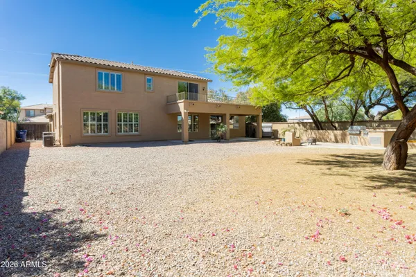 a view of a house with snow on the road