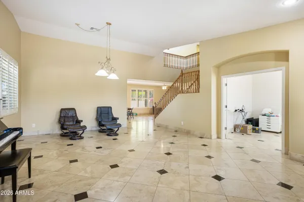 a room with lots of furniture and gym equipment