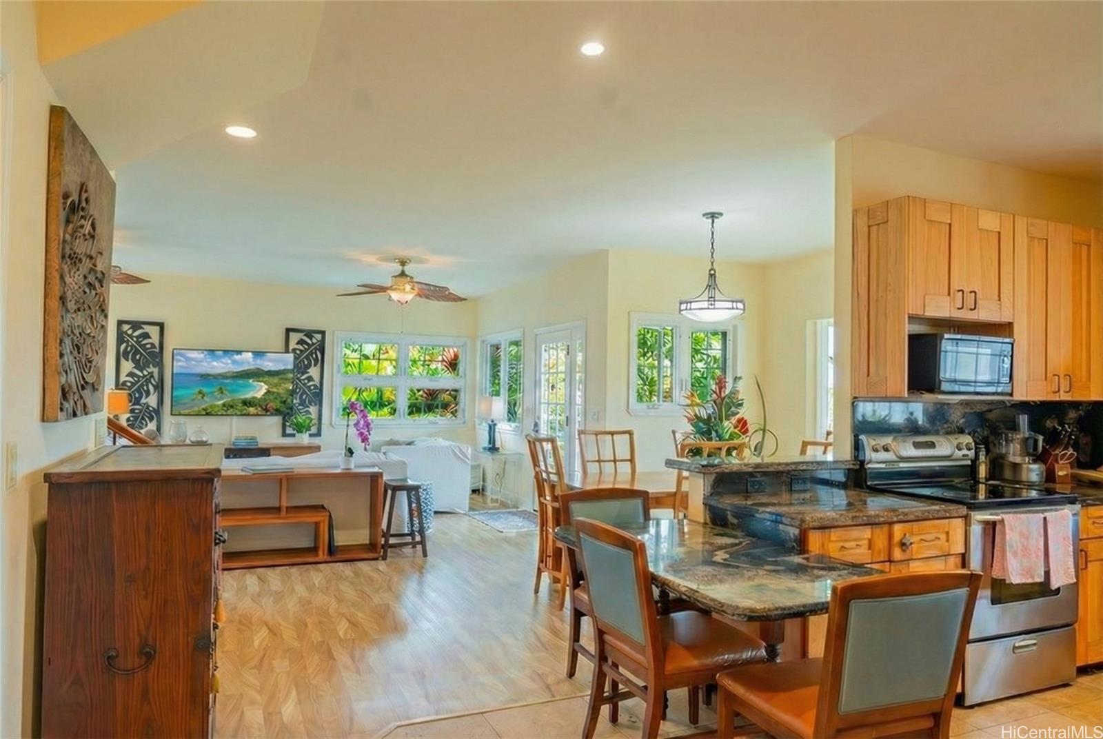 4026 Harding Avenue Honolulu, HI 96816 - Photo 16 of 18 a dining room with furniture a chandelier and wooden floor