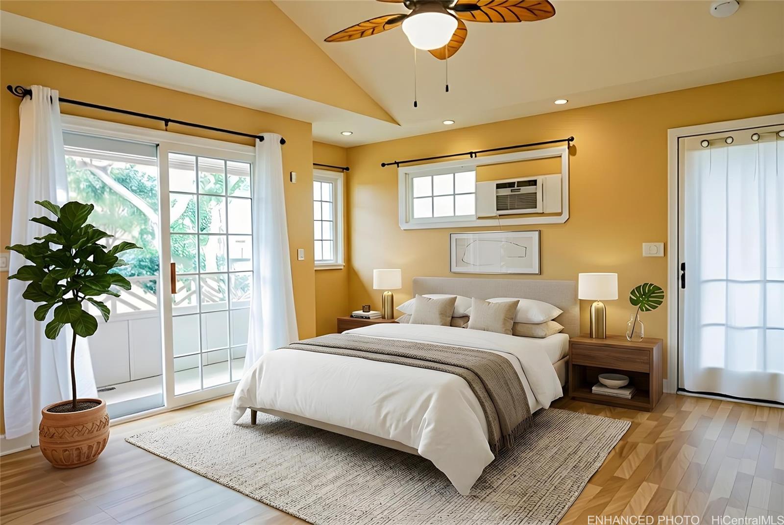 4026 Harding Avenue Honolulu, HI 96816 - Photo 3 of 18 a bedroom with a large bed and a potted plant