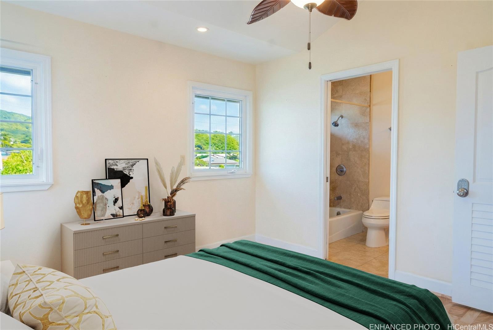 4026 Harding Avenue Honolulu, HI 96816 - Photo 8 of 18 a bedroom with a bed and a dresser