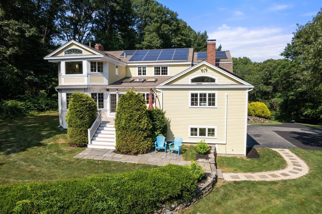 24 Russett Hill Road Sherborn, MA 01770 - Photo 34 of 39 a front view of a house with a yard