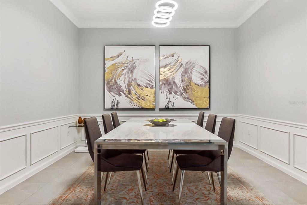 5049 Shoreway Loop, Unit 40601 Orlando, FL 32819 - Photo 11 of 28 a view of a dining room with furniture