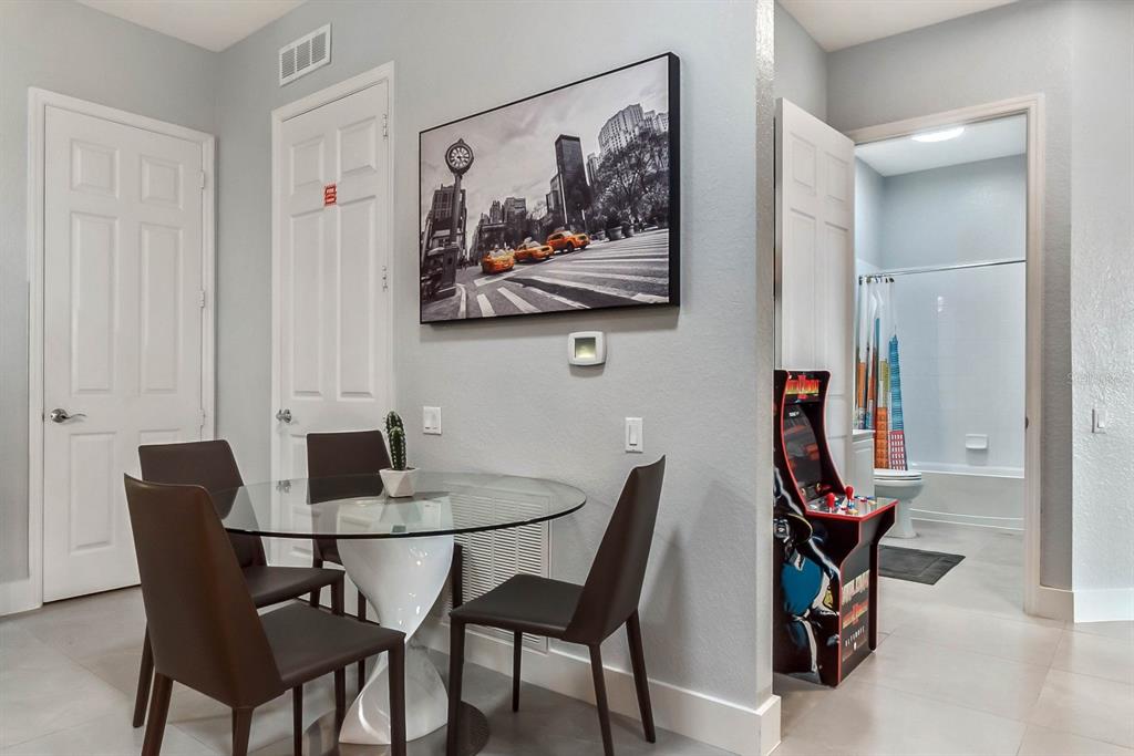 5049 Shoreway Loop, Unit 40601 Orlando, FL 32819 - Photo 12 of 28 a view of a dining room with furniture