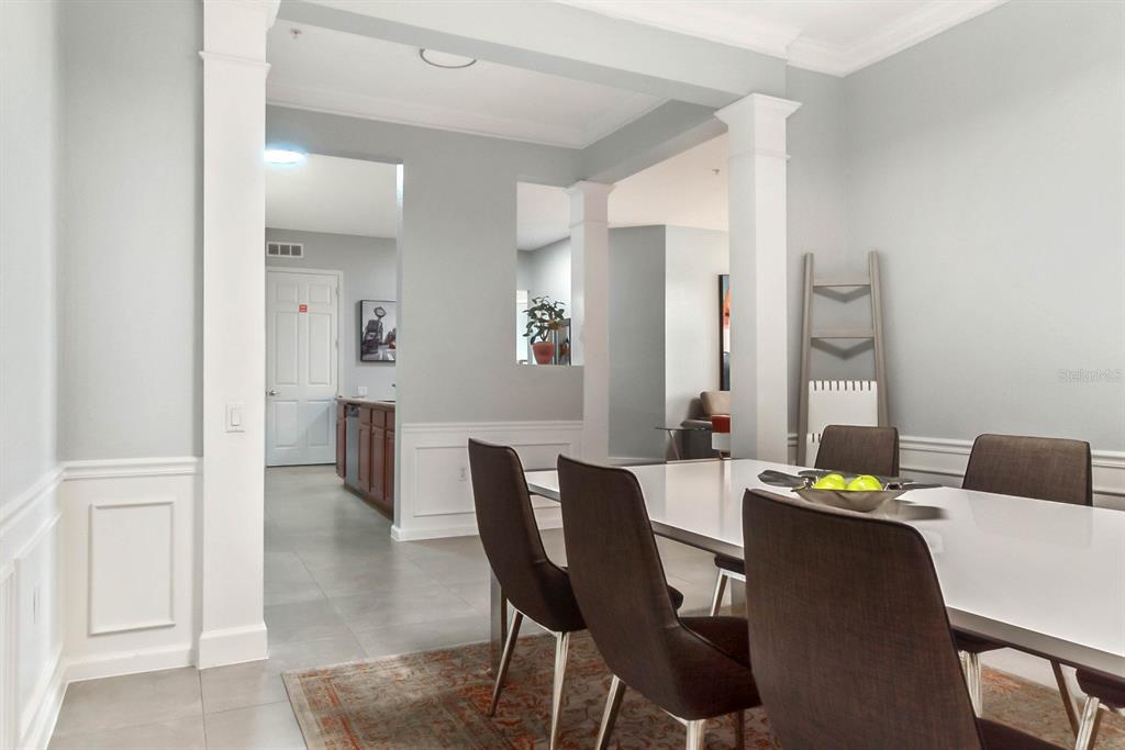 5049 Shoreway Loop, Unit 40601 Orlando, FL 32819 - Photo 13 of 28 a dining room with furniture and window