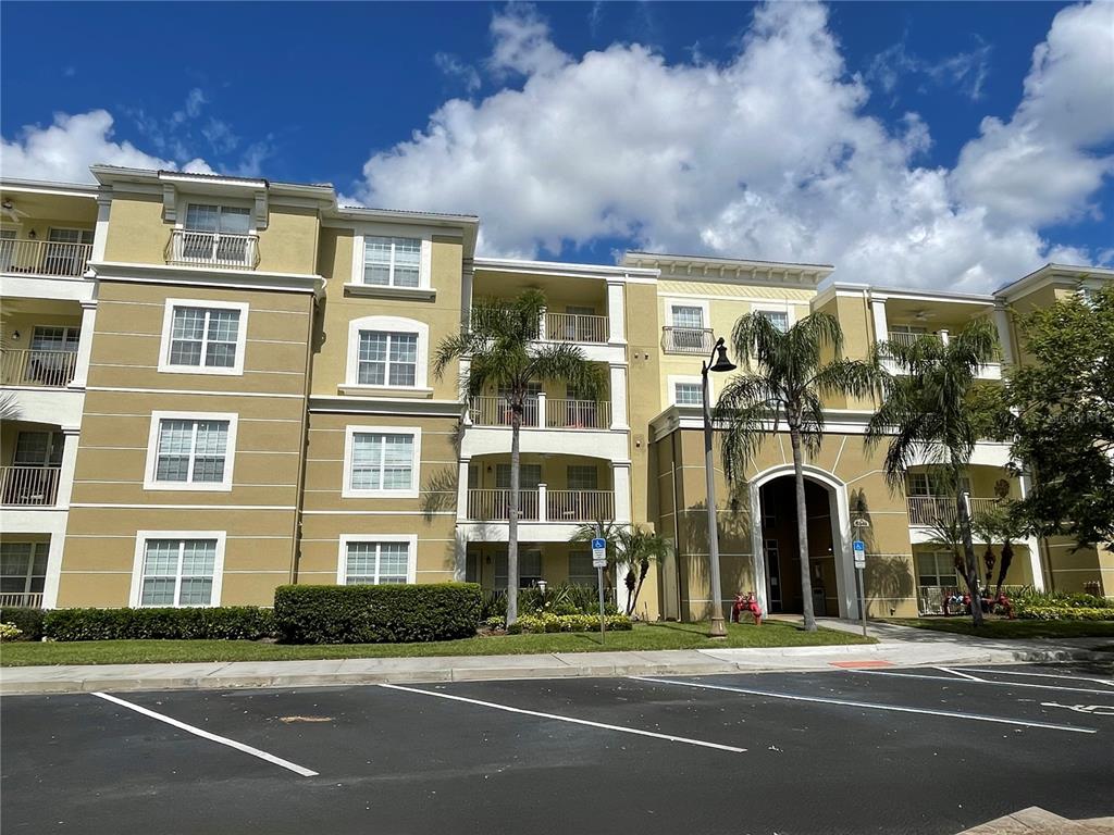 5049 Shoreway Loop, Unit 40601 Orlando, FL 32819 - Photo 2 of 28 a view of a building with a street