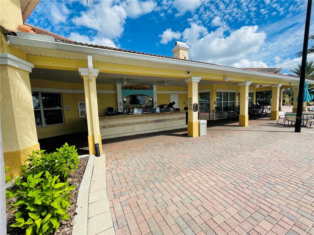 5049 Shoreway Loop, Unit 40601 Orlando, FL 32819 - Photo 25 of 28 a view of a building with a porch