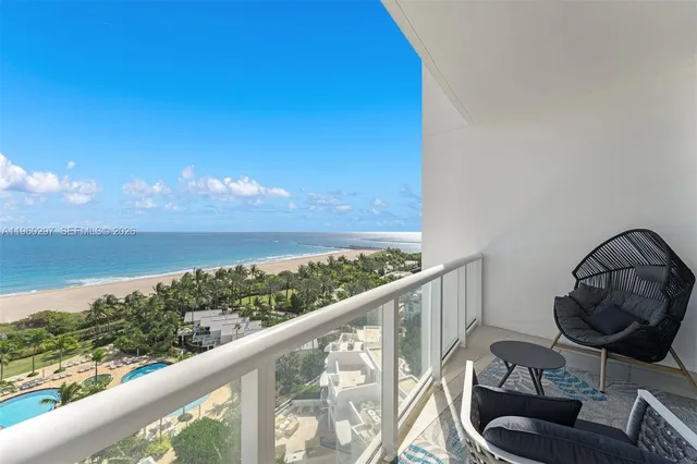 a view of a balcony with furniture