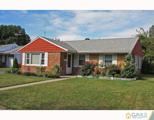 18 Roger Road Edison, NJ 08817 - Photo 1 of 8 a front view of a house with a yard