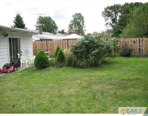18 Roger Road Edison, NJ 08817 - Photo 3 of 8 a view of a backyard with a garden and plants