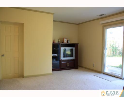 18 Roger Road Edison, NJ 08817 - Photo 5 of 8 a living room with a couch and a window