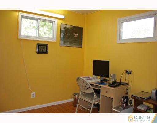 18 Roger Road Edison, NJ 08817 - Photo 7 of 8 a view of a workspace with furniture and a window