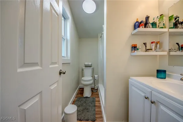 a bathroom with a toilet and a sink