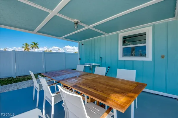 a dining room with a table and chairs