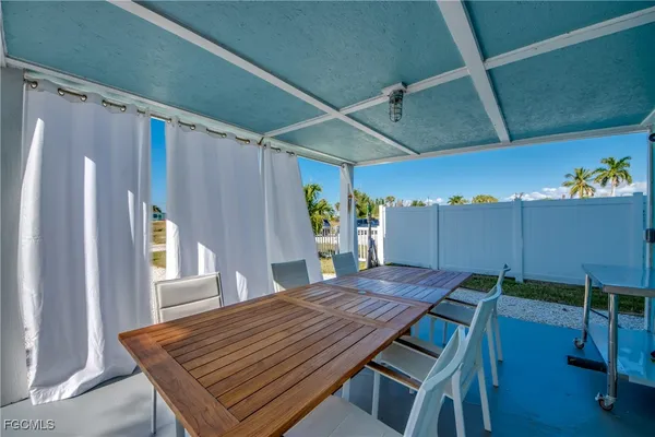 a view of a table and chairs in patio