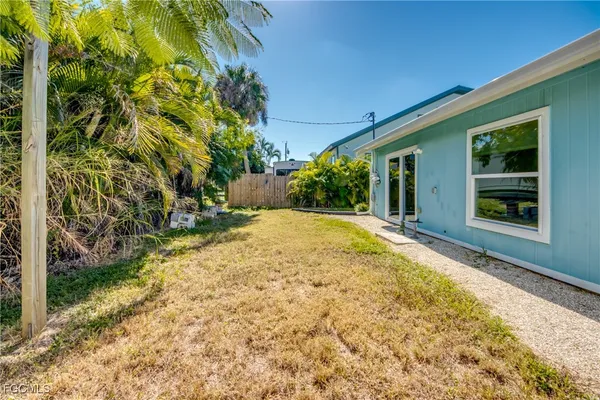 a backyard of a house with lots of green space