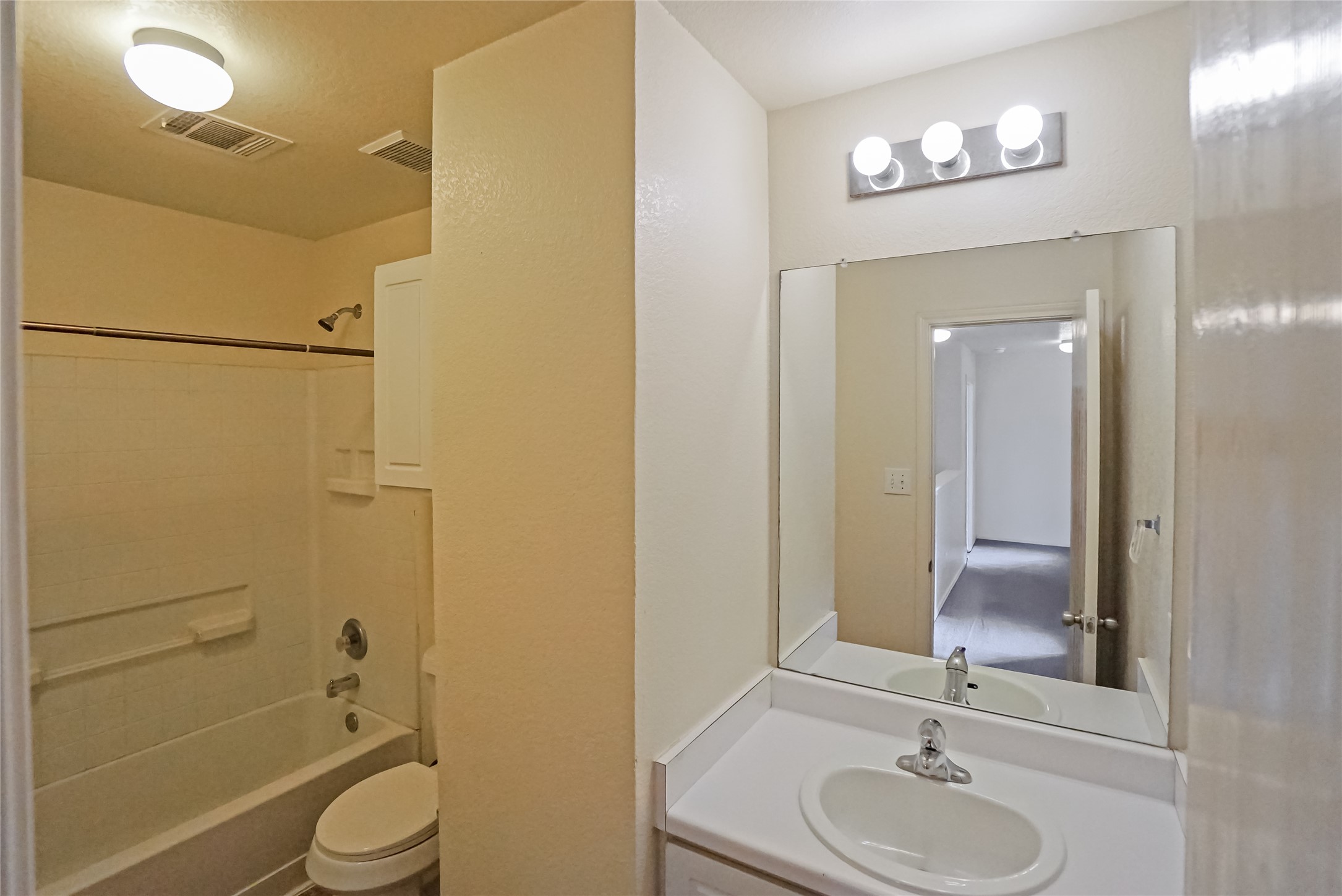 714 Lavaca Loop Elgin, TX 78621 - Photo 15 of 38 Bathroom with vanity and bathtub / shower combination