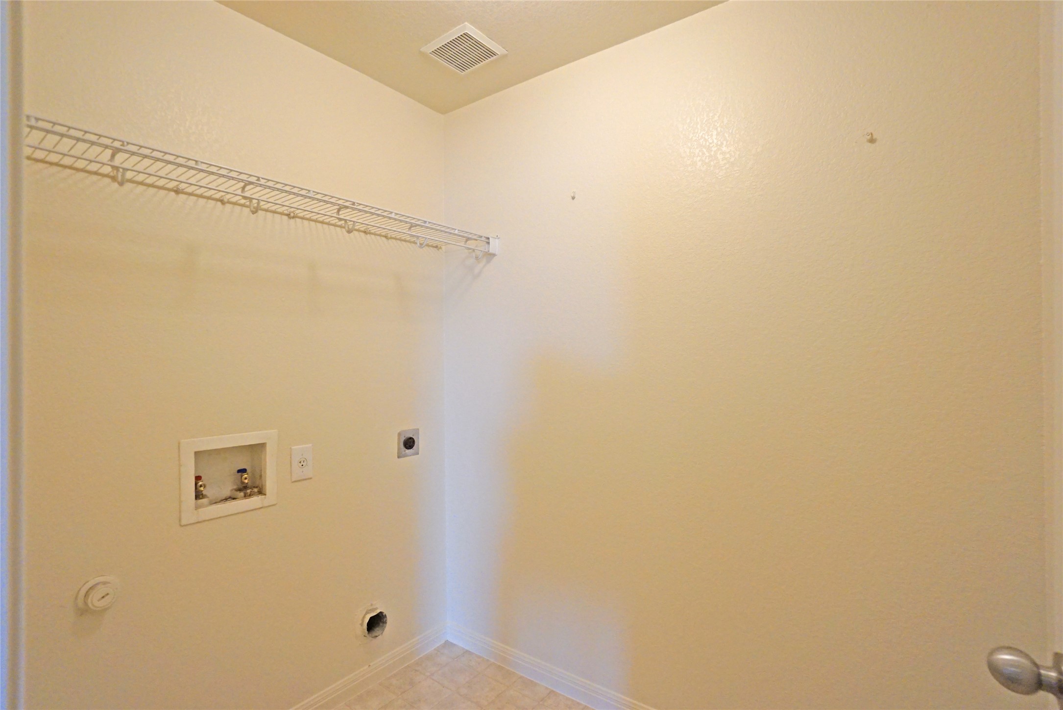 714 Lavaca Loop Elgin, TX 78621 - Photo 18 of 38 Laundry area featuring washer hookup and electric dryer hookup
