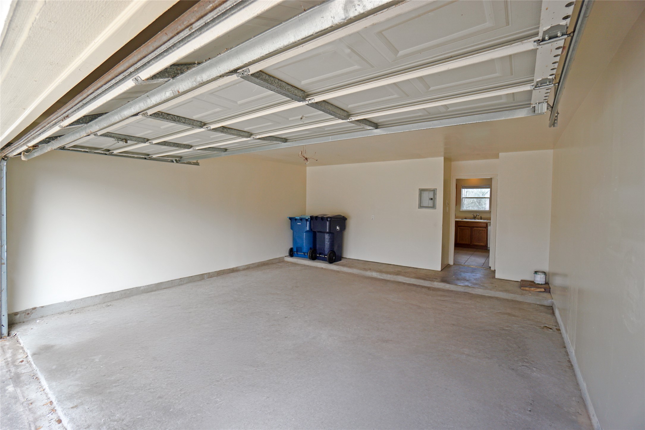 714 Lavaca Loop Elgin, TX 78621 - Photo 19 of 38 Garage with baseboards