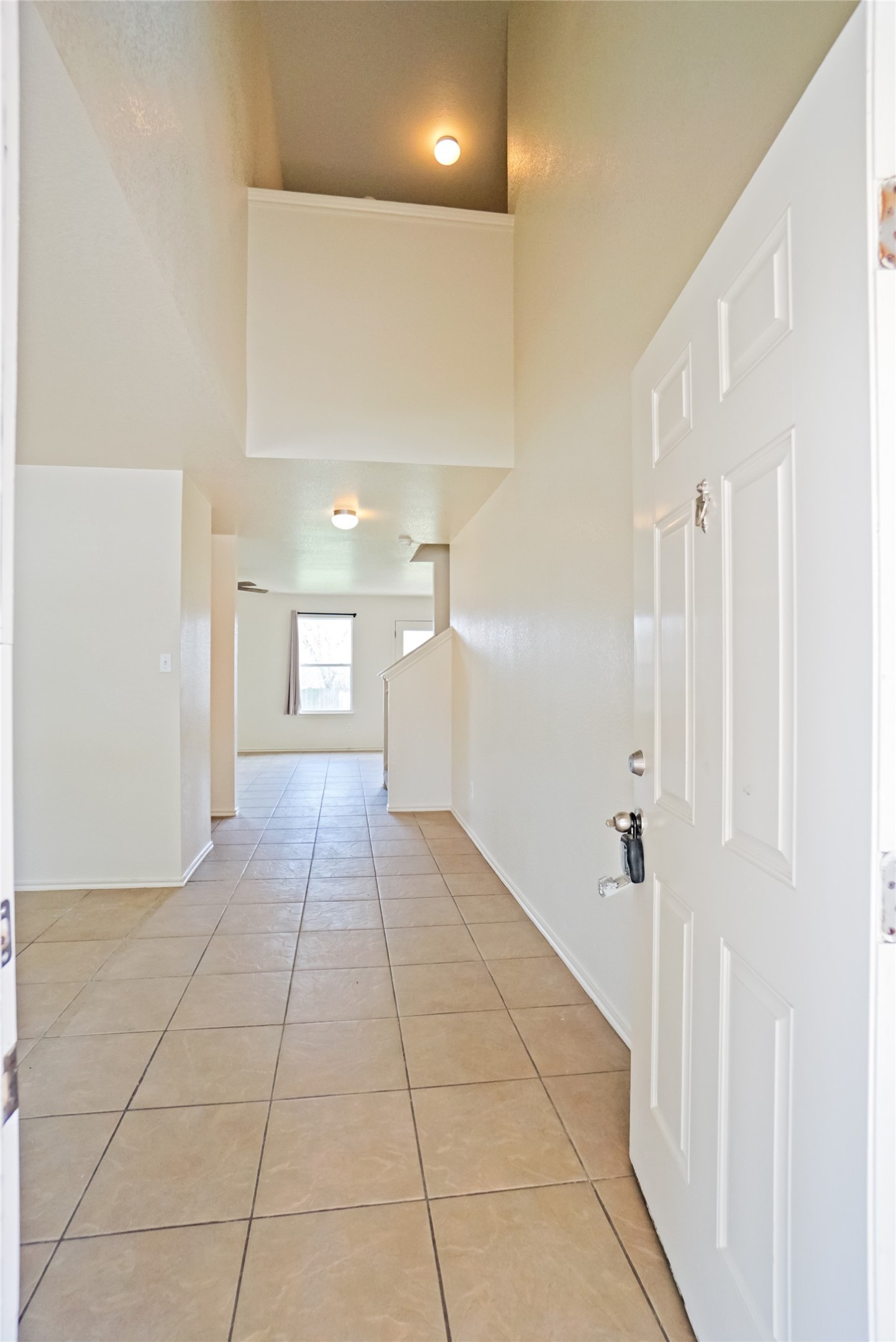 714 Lavaca Loop Elgin, TX 78621 - Photo 23 of 38 Corridor with light tile patterned floors and baseboards