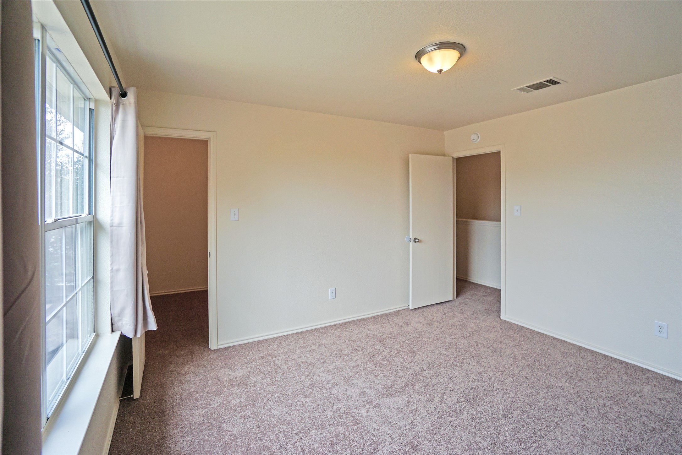 714 Lavaca Loop Elgin, TX 78621 - Photo 29 of 38 Unfurnished bedroom featuring carpet floors and baseboards
