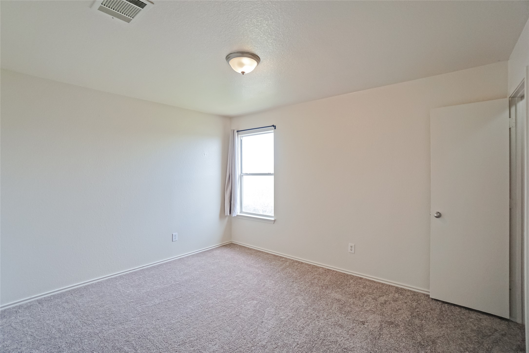 714 Lavaca Loop Elgin, TX 78621 - Photo 30 of 38 Carpeted empty room featuring baseboards
