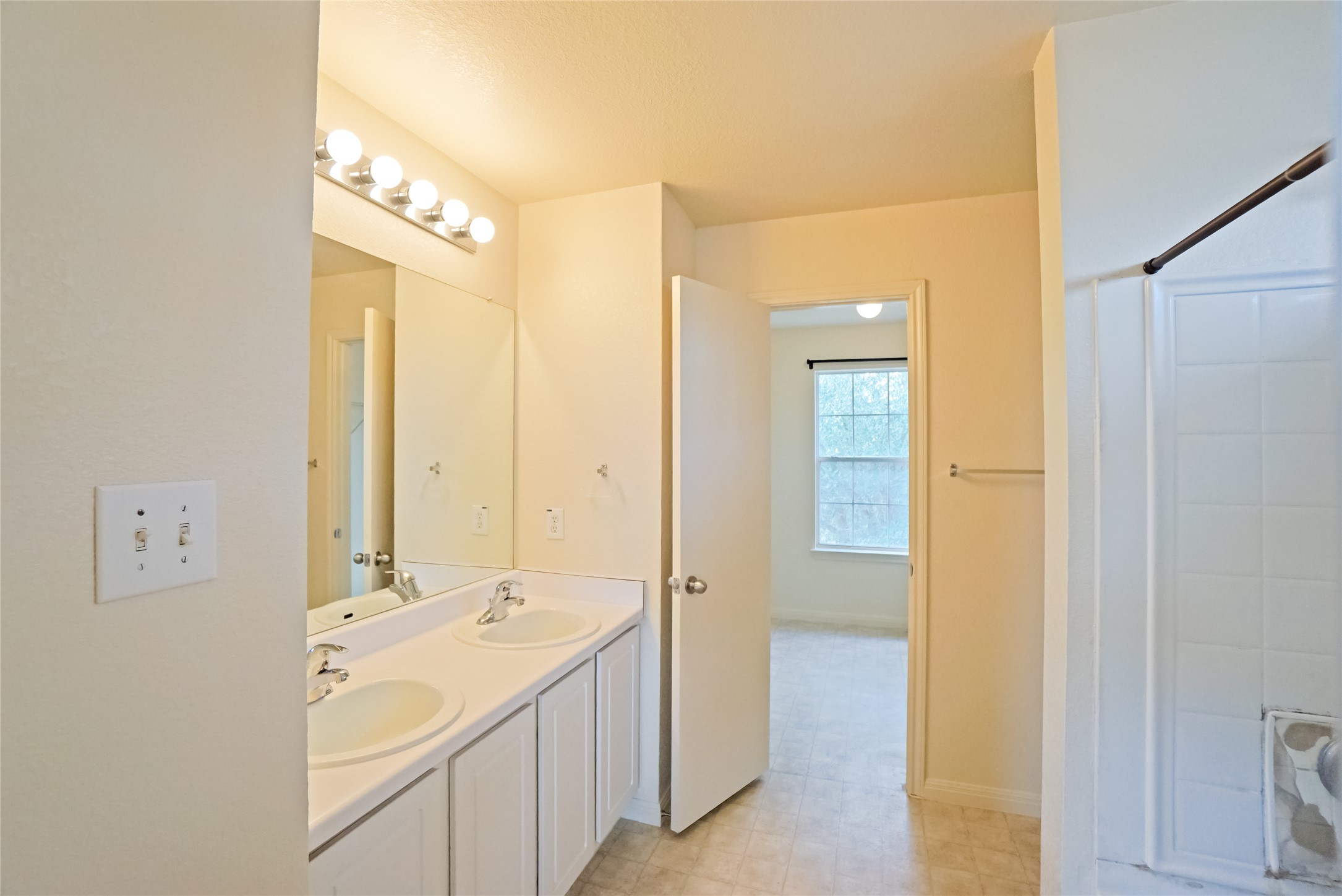 714 Lavaca Loop Elgin, TX 78621 - Photo 31 of 38 Full bath featuring double vanity and baseboards