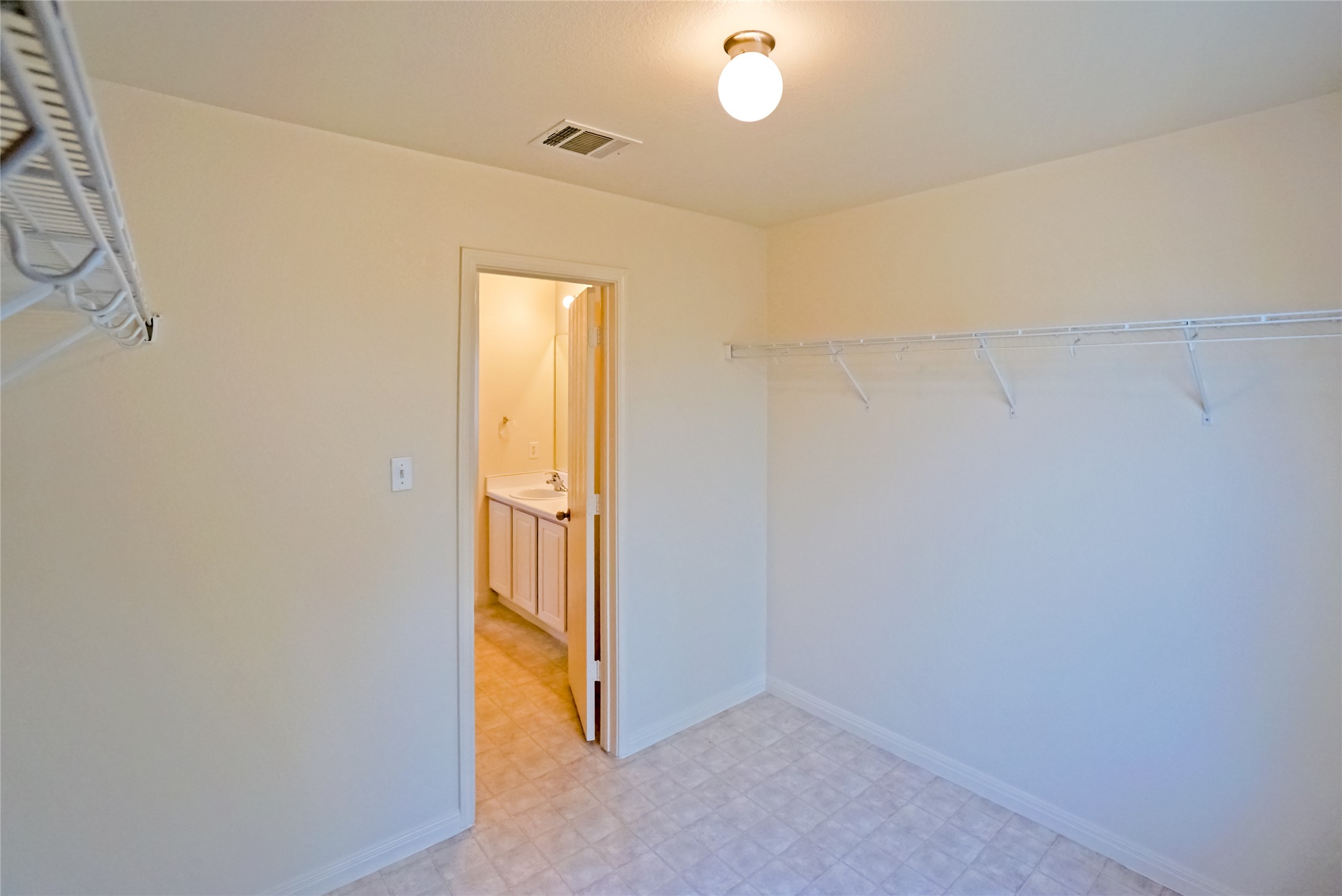 714 Lavaca Loop Elgin, TX 78621 - Photo 36 of 38 Laundry room with light flooring and baseboards