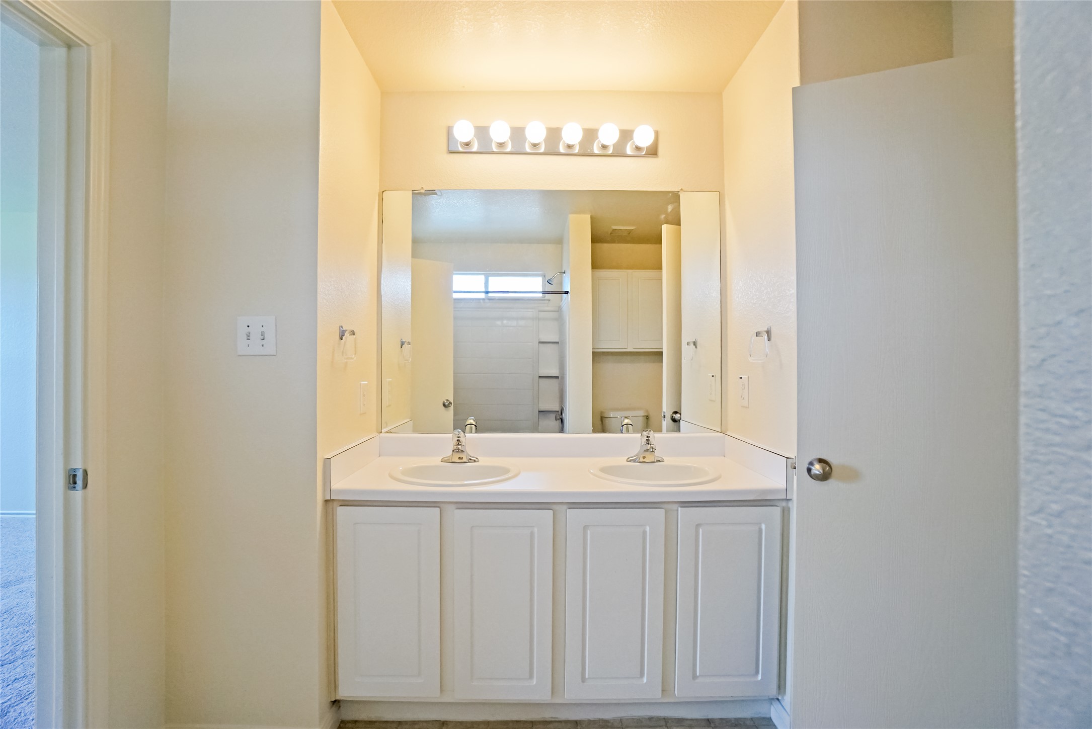 714 Lavaca Loop Elgin, TX 78621 - Photo 37 of 38 Bathroom with double vanity and a shower