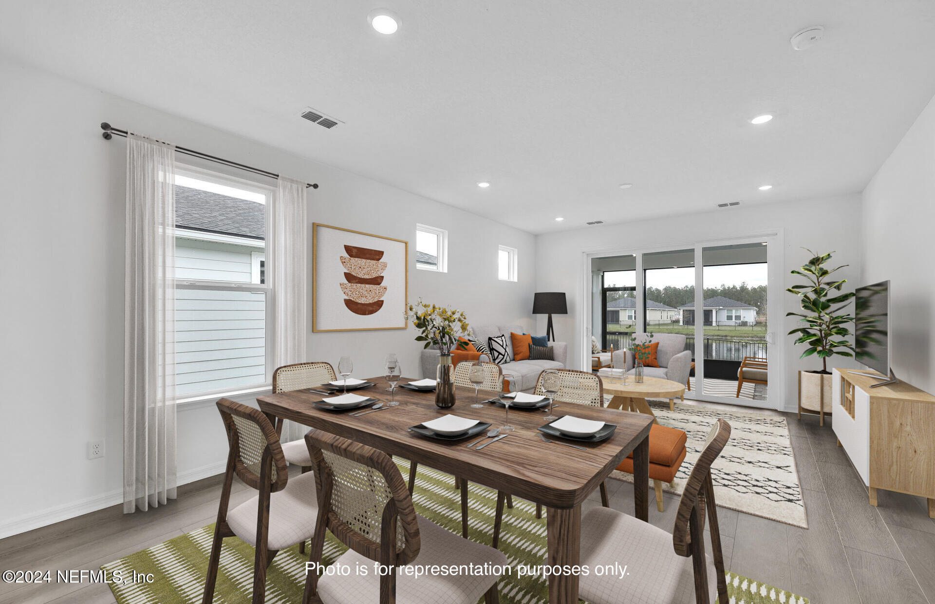 46 Fairlake Circle St. Augustine, FL 32092 - Photo 11 of 45 a view of a dining room with furniture window and wooden floor