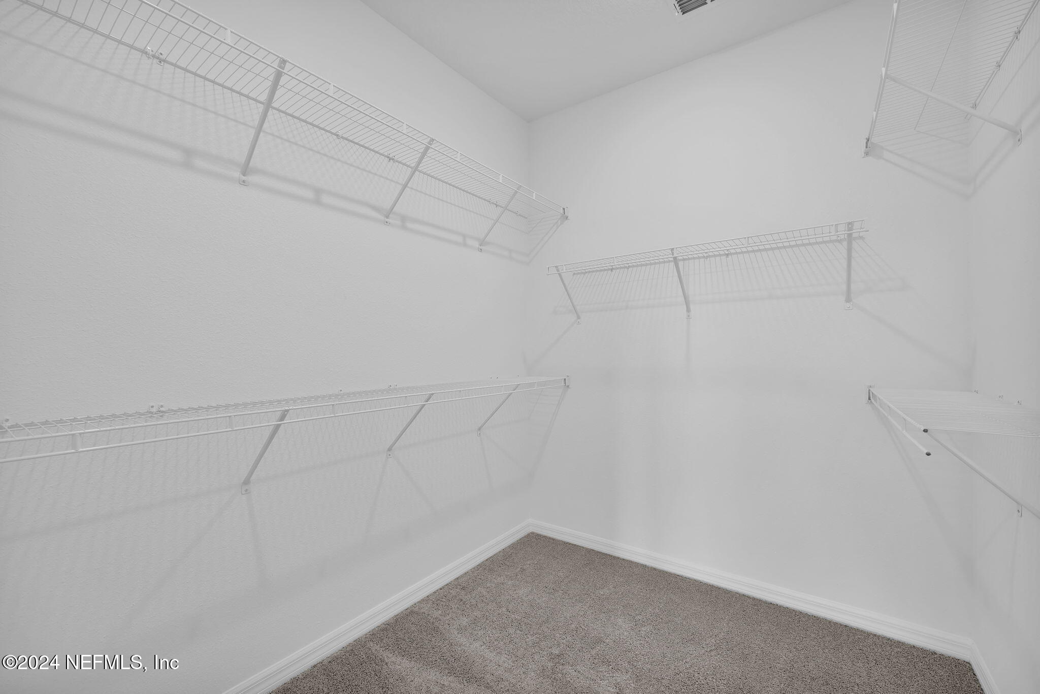 46 Fairlake Circle St. Augustine, FL 32092 - Photo 20 of 45 a view of a room with racks on the wall