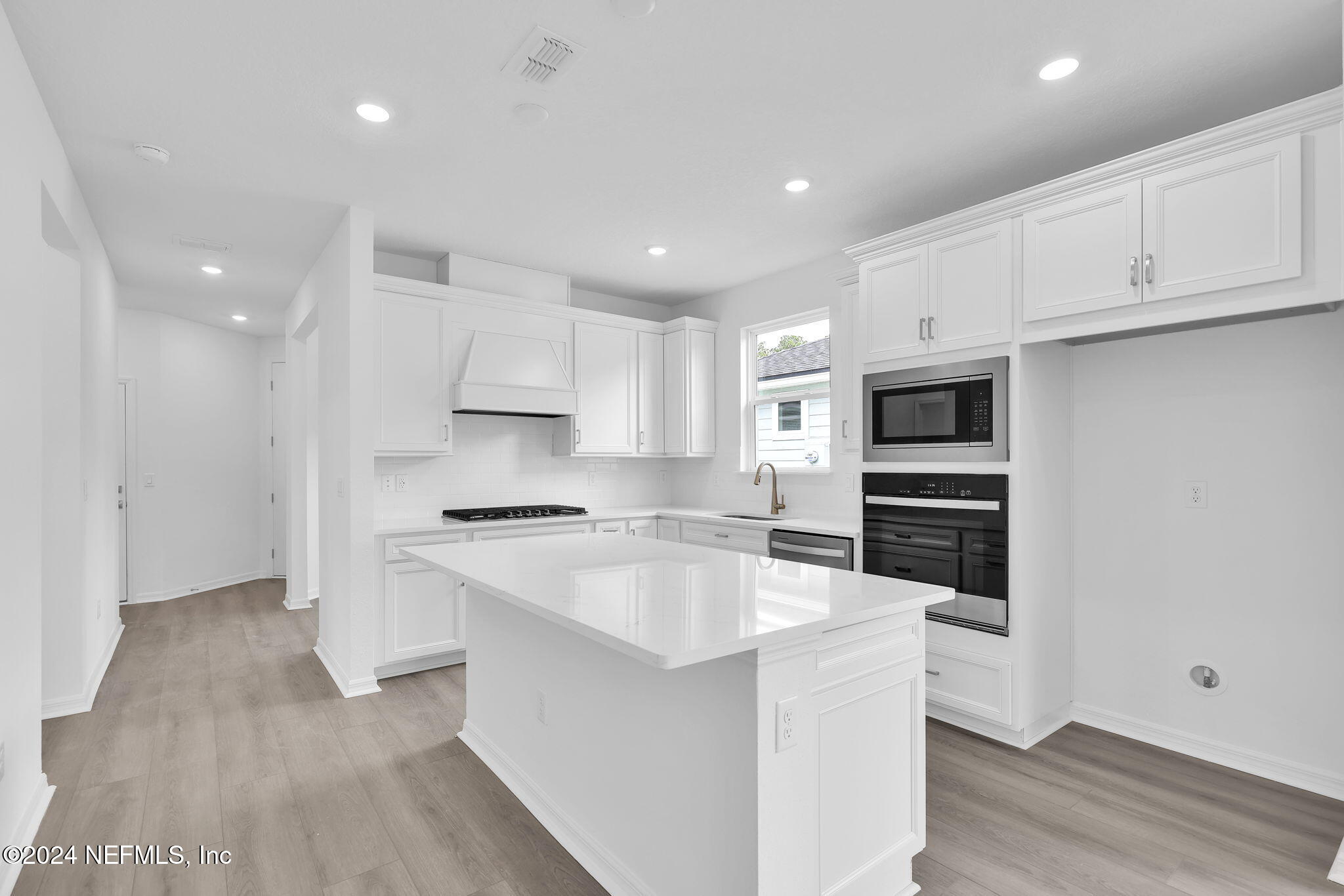 46 Fairlake Circle St. Augustine, FL 32092 - Photo 5 of 45 a kitchen with stainless steel appliances a white stove top oven and a refrigerator