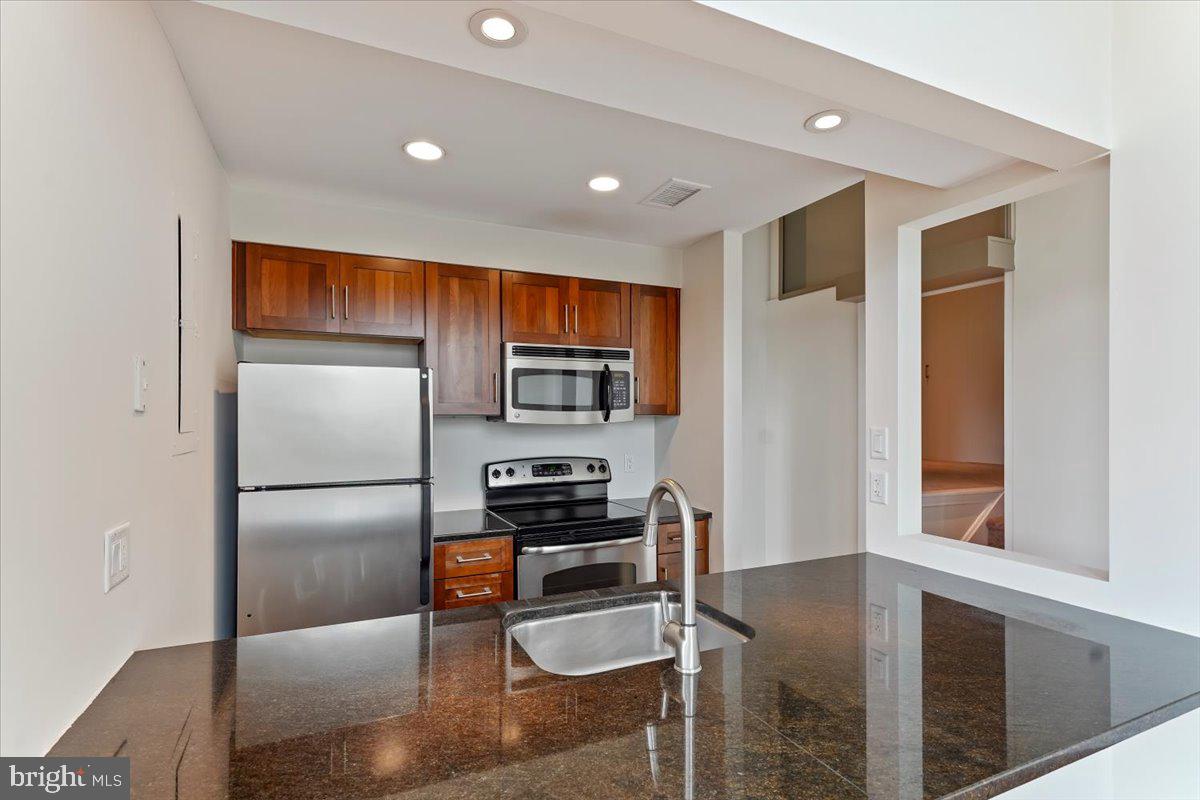 2429 Locust Street, Unit 306 Philadelphia, PA 19103 - Photo 12 of 37 Open kitchen/bar area