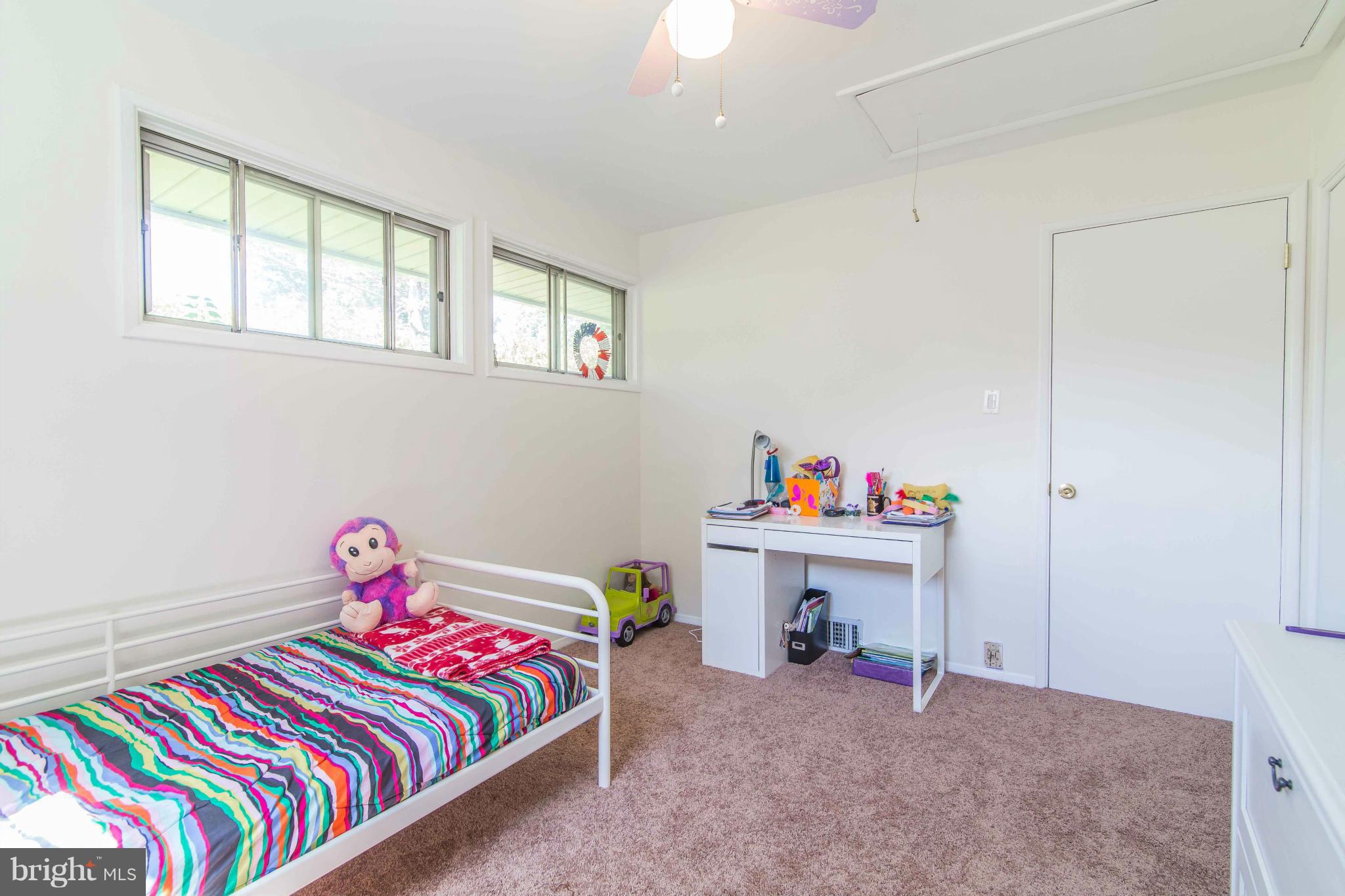 7407 Inzer Street Springfield, VA 22151 - Photo 18 of 29 a bedroom with a bed and a window
