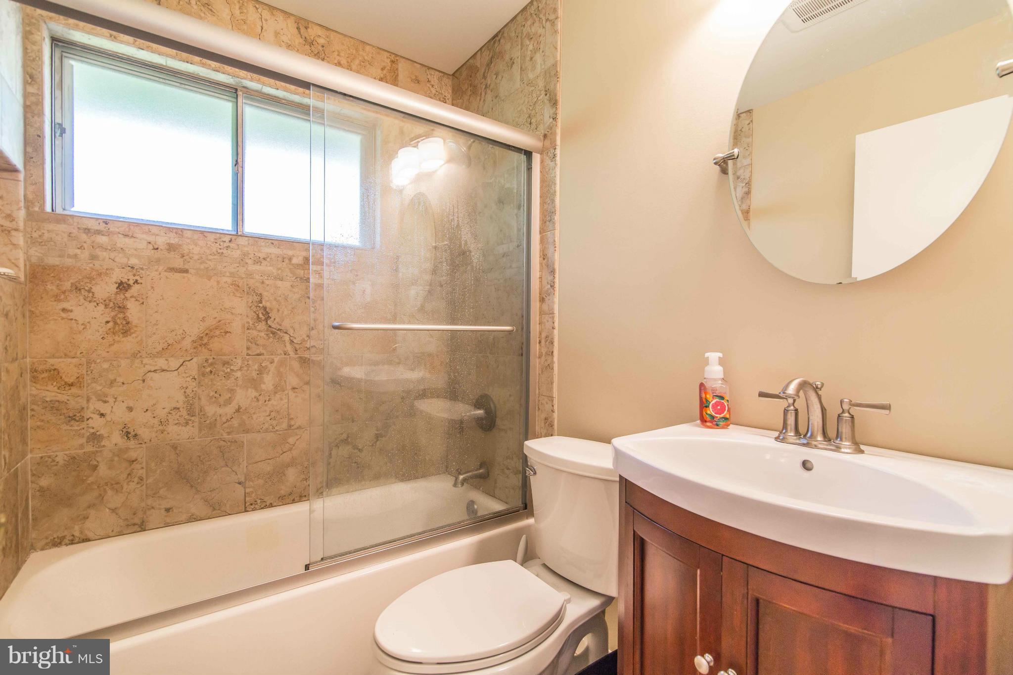 7407 Inzer Street Springfield, VA 22151 - Photo 21 of 29 a bathroom with a sink toilet and shower