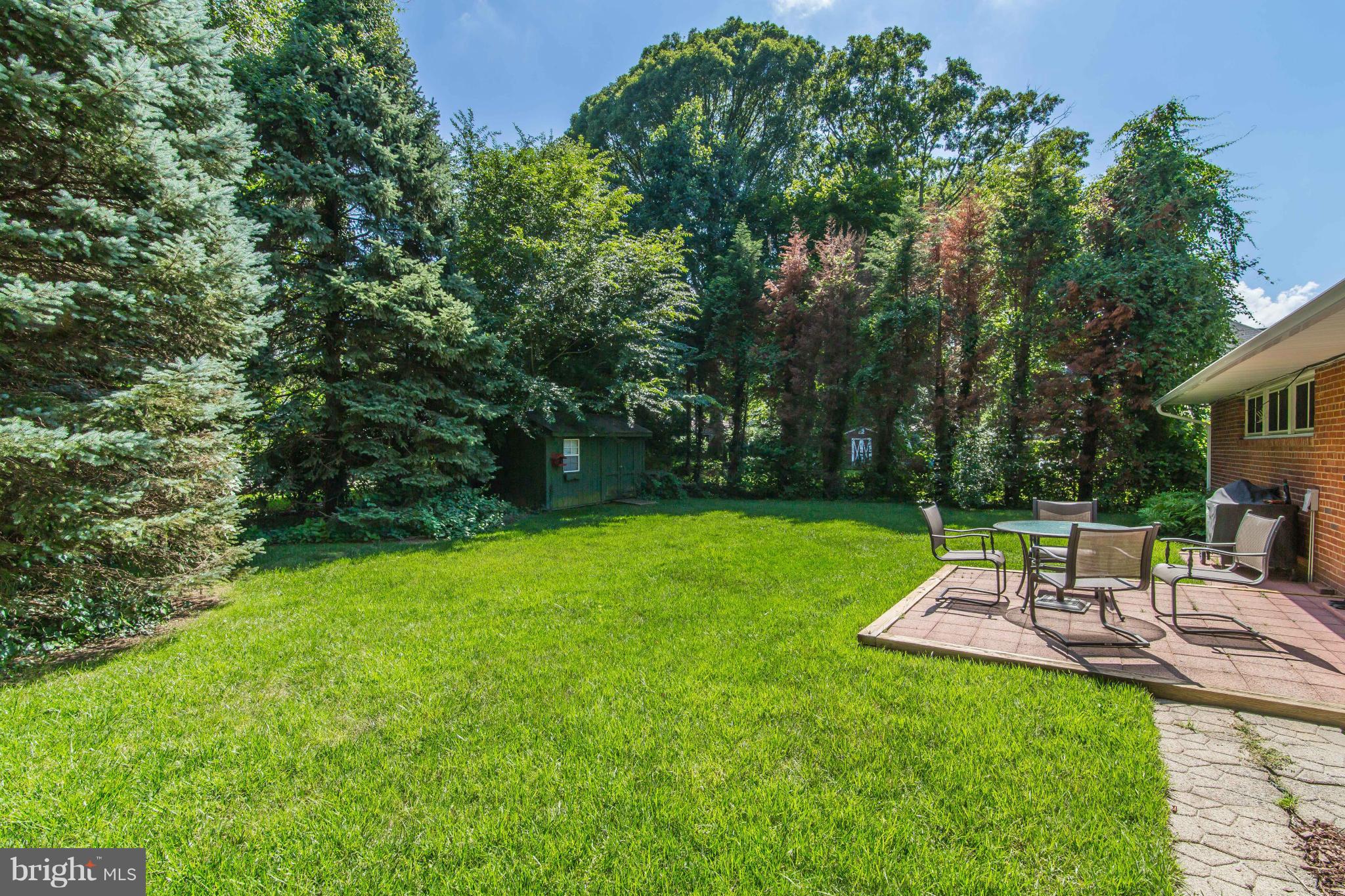 7407 Inzer Street Springfield, VA 22151 - Photo 27 of 29 a view of a backyard with sitting area