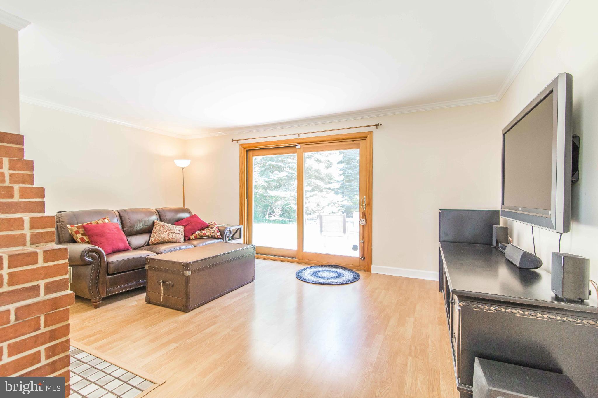 7407 Inzer Street Springfield, VA 22151 - Photo 5 of 29 a living room with furniture and a window