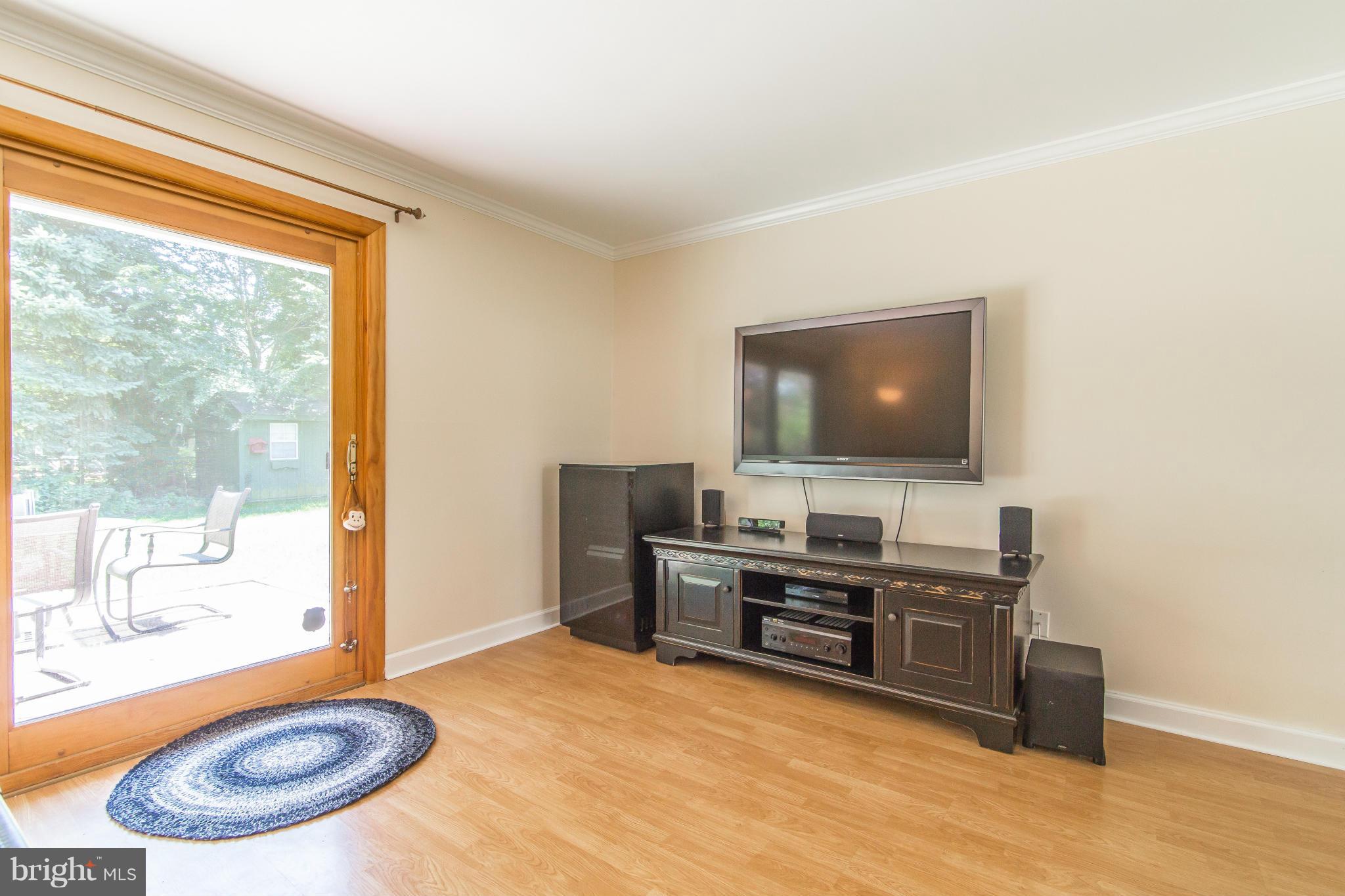 7407 Inzer Street Springfield, VA 22151 - Photo 7 of 29 a view of a livingroom with furniture and a flat screen tv
