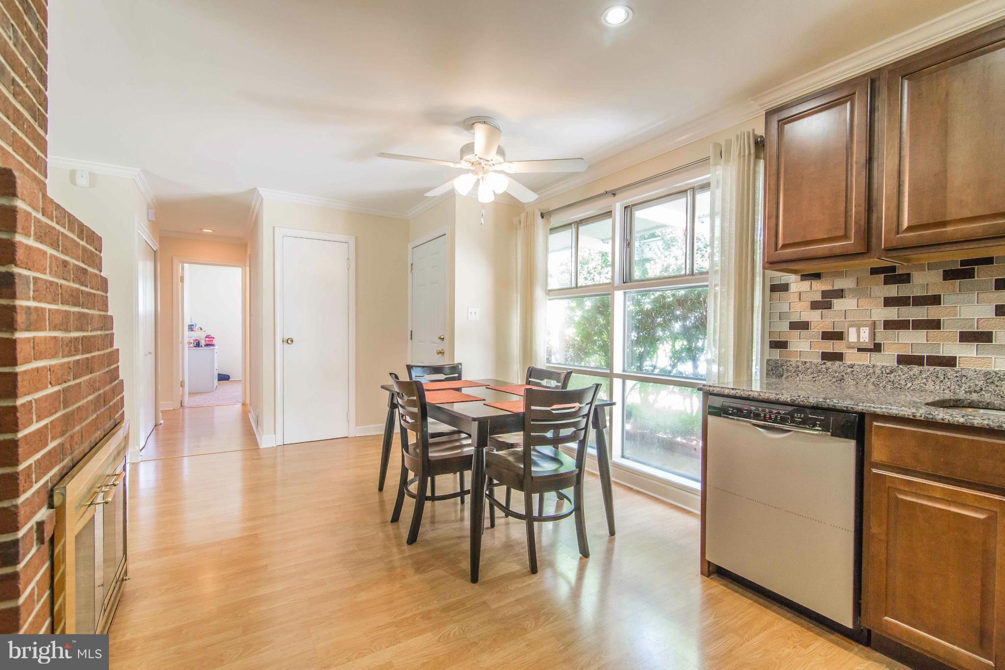 7407 Inzer Street Springfield, VA 22151 - Photo 10 of 29 a dining room with furniture window and wooden floor